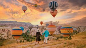 Cappadocia Turkey during sunrise, couple on vacation in the hills of Goreme Capadocia Turkey