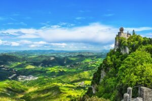 San Marino, medieval tower on a rocky cliff and panoramic view of Romagna