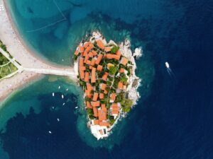 Aerophotography. Aerial view of Sveti Stefan island in a beautiful summer day, Montenegro from