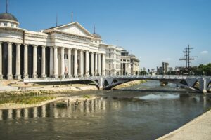 Archaeological Museum of Macedonia surrounded by the river with a bridge on it in north Macedonia