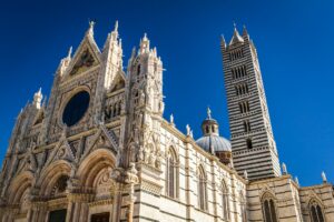 Cathedral of Siena in the summer on a blue sky background