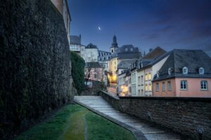 Luxembourg city street at night with St Michaels Church on background - Luxembourg City, Luxembourg