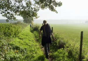 Rear view of teenage boy hiking along ancient roman path, Beaufort, Echternach, Luxembourg