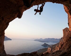 Silhouette of a rock climber at sunset, Kalymnos Island, Greece