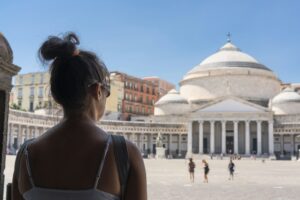 Woman in the Piazza del Plebiscito in Naples. Italy (selective focus).