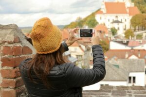 Woman takes a picture with a smartphone