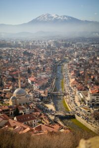 Aerial view of the cityscape of Prizren, Kosovo with mosques on a sunny day